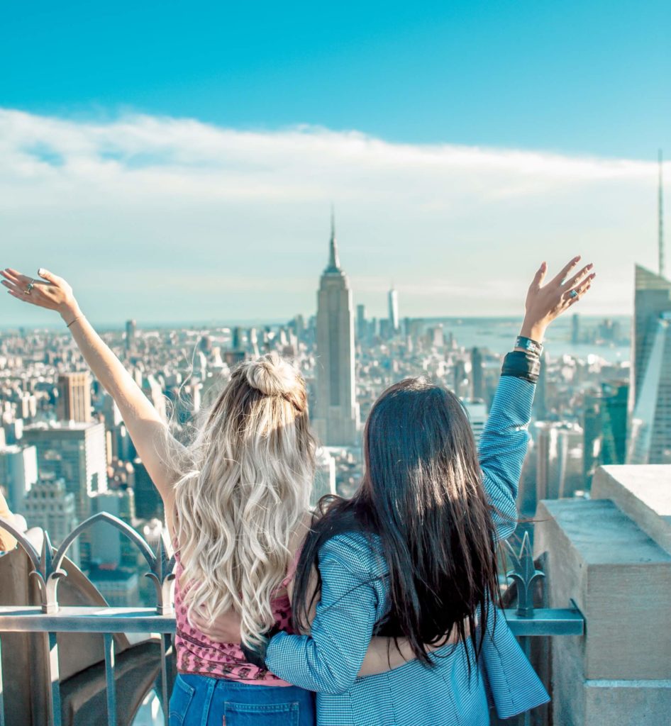 girls looking out over city skyline